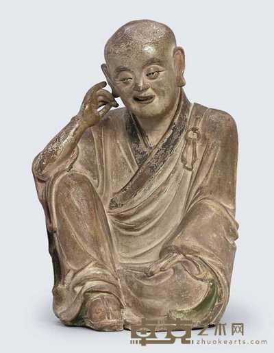 YUAN MING DYNASTY A RARE POLYCHROME STONEWARE FIGURE OF NAGASENA 